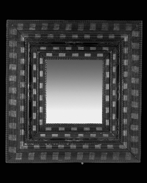 A Dutch black and gilt-heightened ripple moulded mirror, early 20th century