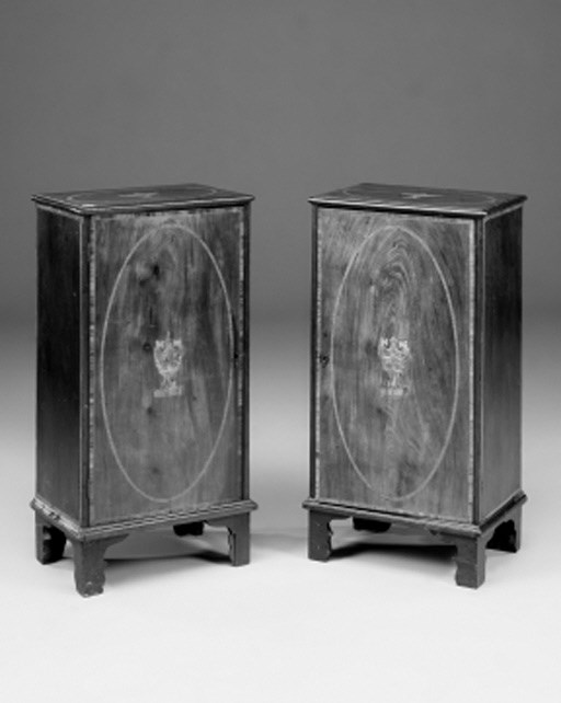 A pair of mahogany, tulipwood-banded and inlaid cabinets, 19th century and later
