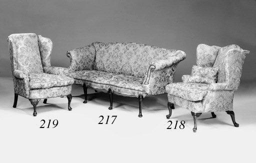 An oak and upholstered wing chair, late 19th/early 20th century