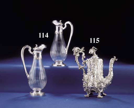A PAIR OF FRENCH SILVER AND CUT-GLASS CLARET JUGS