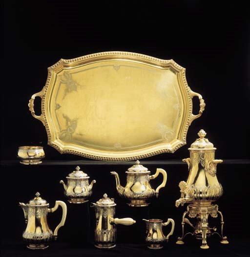 A FRENCH SILVER-GILT SIX-PIECE TEA AND COFFEE SERVICE WITH PLATED KETTLE AND TRAY**