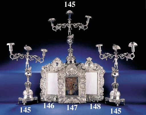 A SET OF THREE PERUVIAN SILVER CANDELABRA