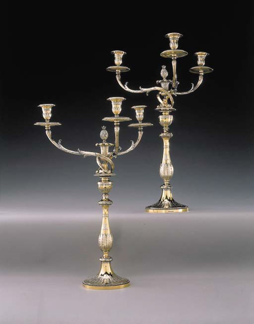 A FINE PAIR OF GEORGE III SILVER-GILT FOUR-LIGHT CANDELABRA