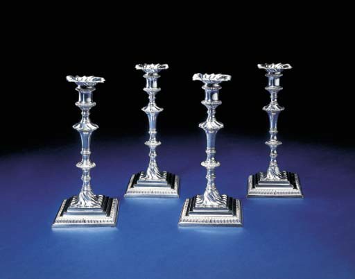 A SET OF FOUR GEORGE III SILVER CANDLESTICKS