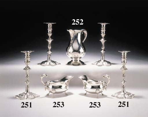 A SET OF FOUR GEORGE II SILVER CANDLESTICKS