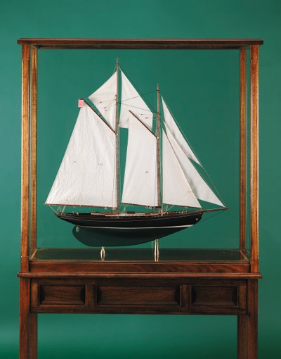 A detailed display model of a gaff schooner rigged auxillary cruising yacht