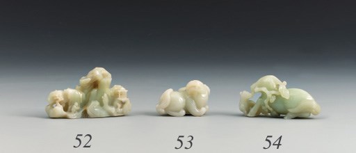 A CELADON JADE 'MYTHICAL BEAST' GROUP