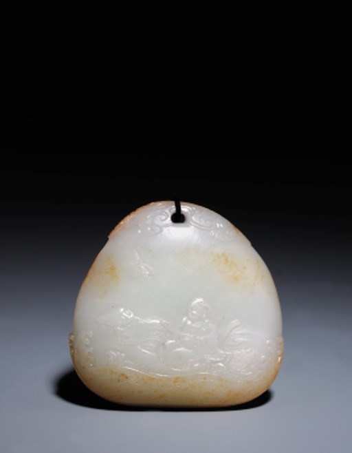 A FINE WHITE JADE PEBBLE-FORM PENDANT