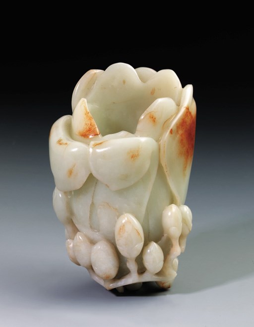 A WHITE AND RUSSET JADE FLORAL VASE