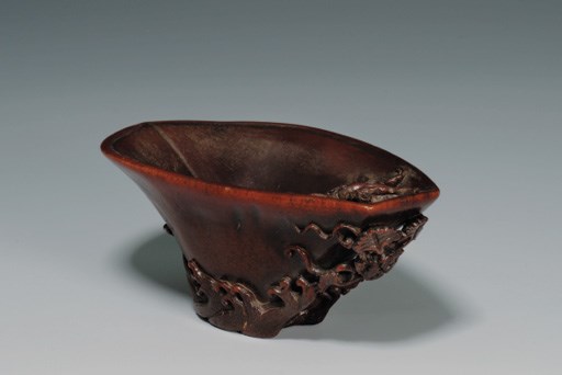 A RHINOCEROS HORN LIBATION CUP