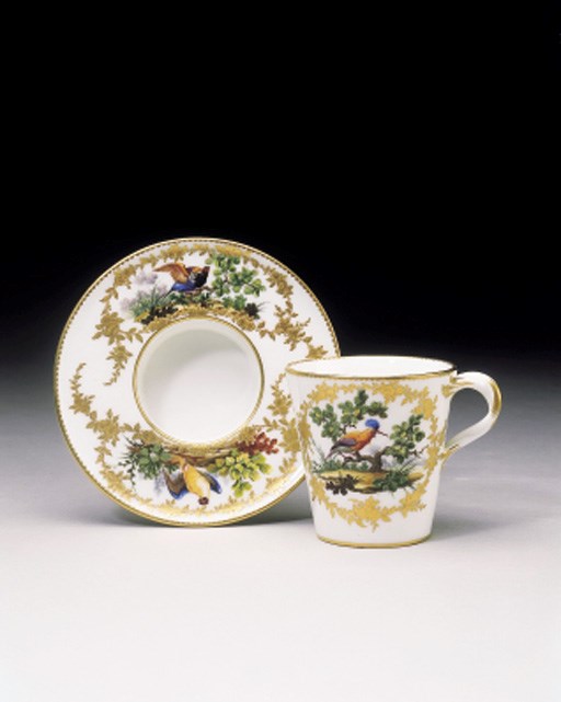 A SEVRES CUP AND SOCKETED SAUCER (GOBELET ET SOUCOUPE 'ENFONCE,' 1ERE GRANDEUR)