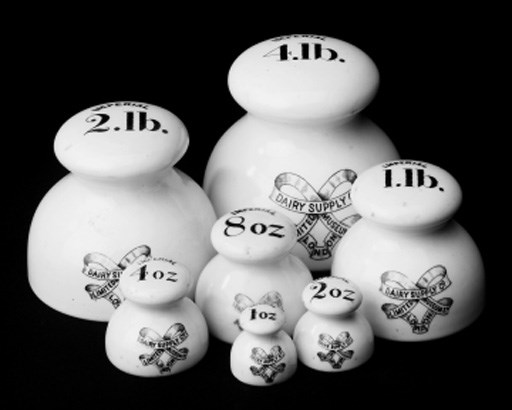 A set of seven Imperial Dairy weights,