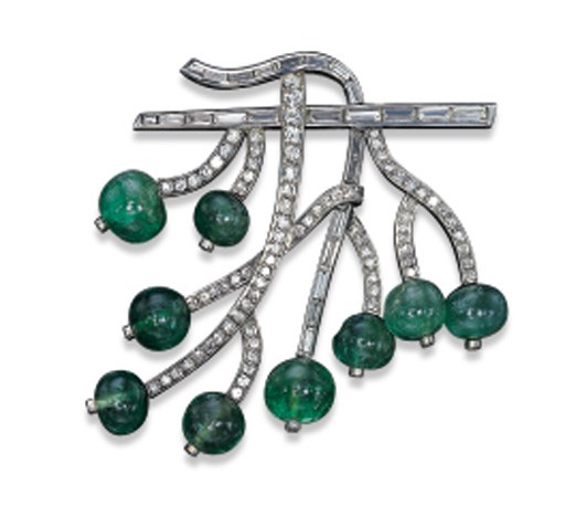 AN EMERALD BEAD AND DIAMOND BROOCH