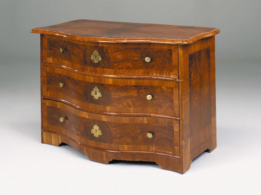 A South German walnut, crossbanded serpentine chest, 18th century and later
