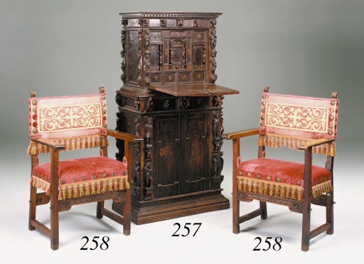 An Italian carved walnut writing cabinet, 17th century and later, possibly Bolognese