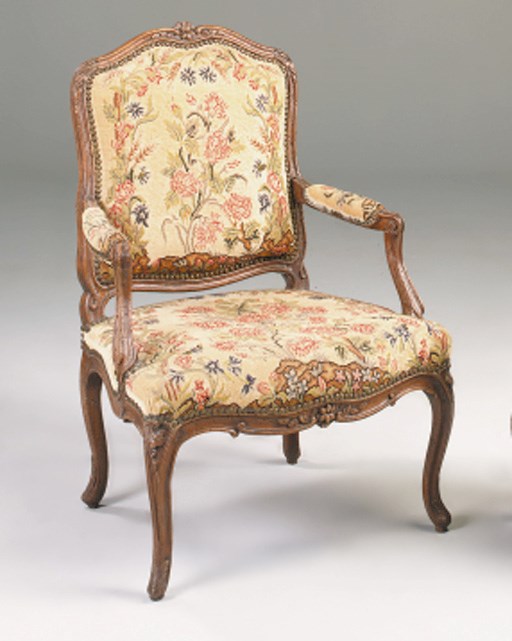 An early Louis XV carved beechwood fauteuil a la reine