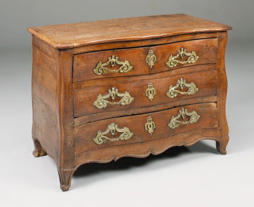 A  Louis XV carved yew-wood bombe commode