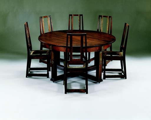 AN OAK DINING TABLE AND SIX SIDE CHAIRS