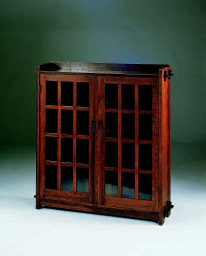 AN OAK TWO-DOOR BOOKCASE