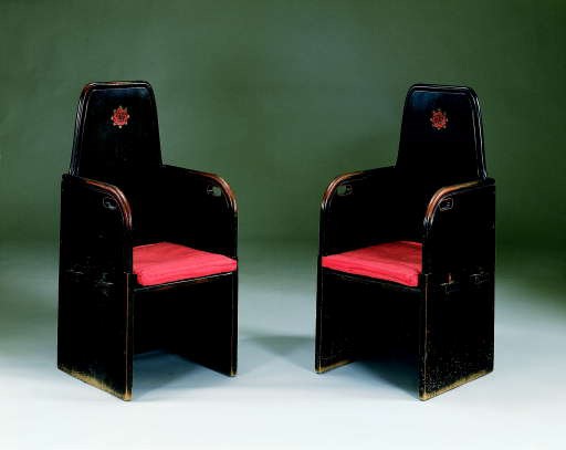 A PAIR OF STAINED OAK ARMCHAIRS