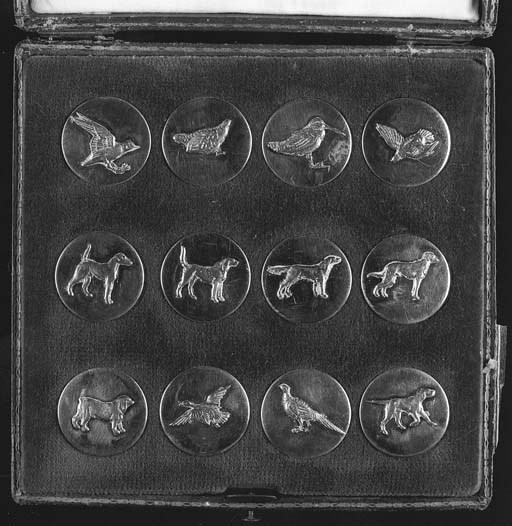 A cased set of twelve silver buttons, applied with various dogs and fowl, including a retriever, beagle and pheasant--1in. (2.5cm.), 19th century, the red case stamped AUGUSTIN, buttons stamped with maker's mark