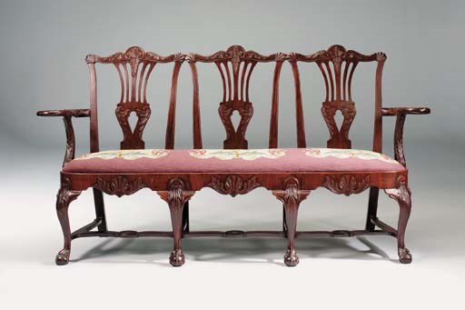 AN IRISH MAHOGANY TRIPLE CHAIR-BACK SETTEE