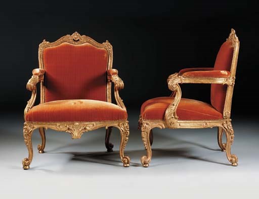 A PAIR OF GEORGE II GILTWOOD ARMCHAIRS