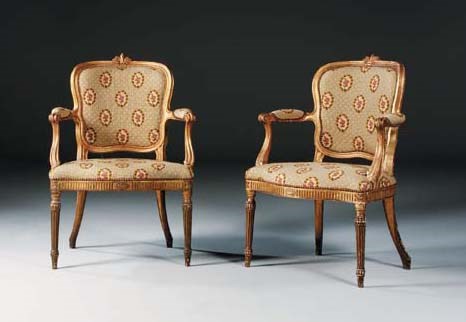 A SET OF FOUR GEORGE III GILTWOOD OPEN ARMCHAIRS