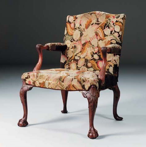A GEORGE II MAHOGANY LIBRARY OPEN ARMCHAIR