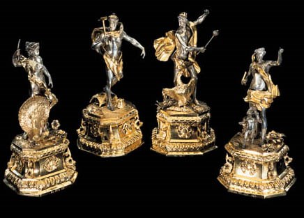 A SET OF FOUR GERMAN PARCEL-GILT STATUETTES