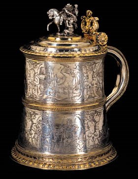 A GERMAN PARCEL-GILT TANKARD