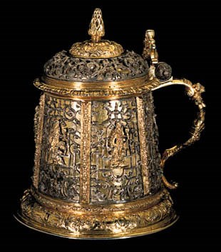 A GERMAN PARCEL-GILT TANKARD