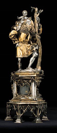A GERMAN LATE GOTHIC PARCEL-GILT STATUETTE OF SAINT CHRISTOPHER ON RELIQUARY BASE
