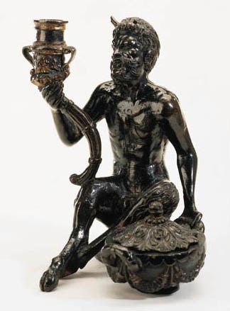 A BRONZE GROUP OF A CANDLESTICK-BEARING SATYR WITH AN INKWELL