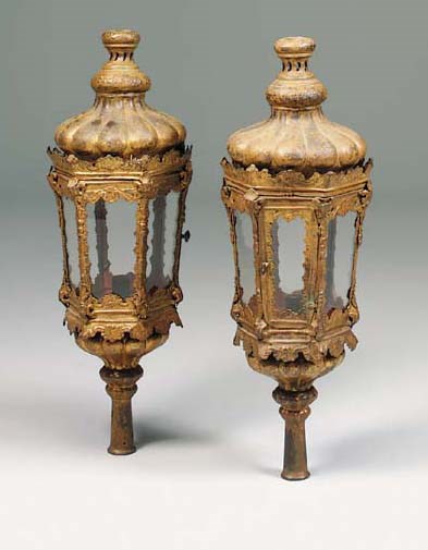 A pair of Venetian gilt repoussé copper pole lanterns, basically 18th century