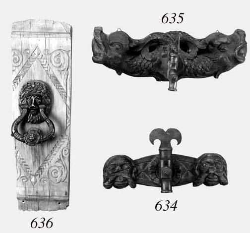 A Central European carved wood and brass wine barrel spigot