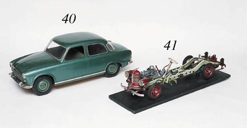 A good pre-war driving-school instructional model by Höhm; supremely detailed cutaway working model depicting every function of a motor-car chassis; mechanically operated via starting-handle, featuring clutch, gearbox, transmission, brakes, differential, lights etc. European c1938. Length 42ins (107cm)