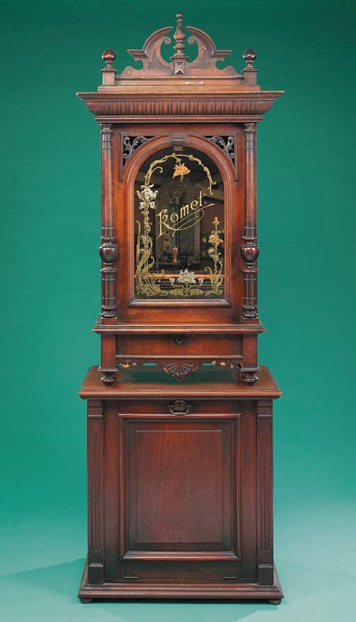 A Komet 203/8-inch upright disc musical box