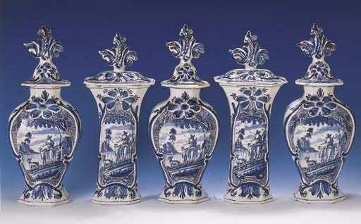 A large Dutch Delft blue and white pastoral octagonal garniture