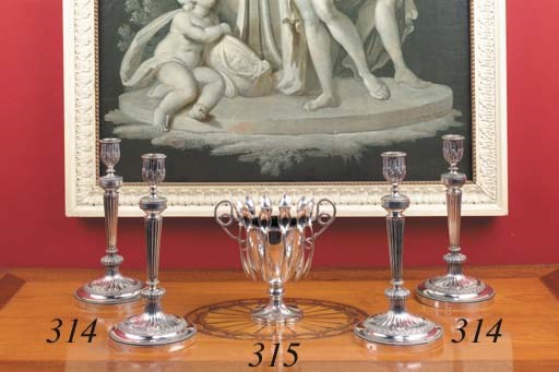 A Dutch silver sugar vase with twelve non-matching spoons