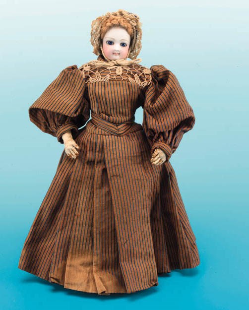 A pressed bisque swivel-headed fashionable doll