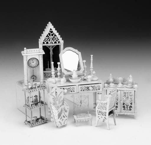 A group of carved bone dolls' house furniture