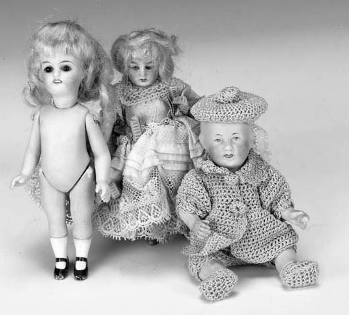 A bisque-headed dolls' house doll