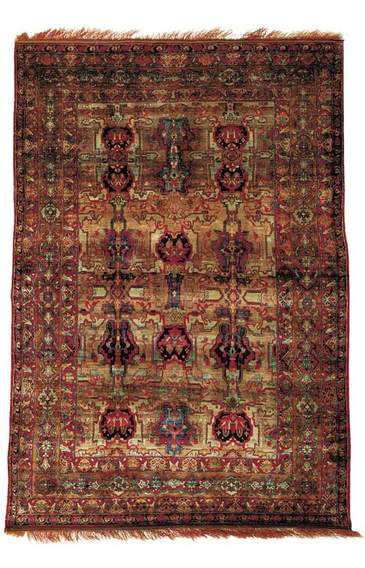 A SILK KIRMAN RUG
