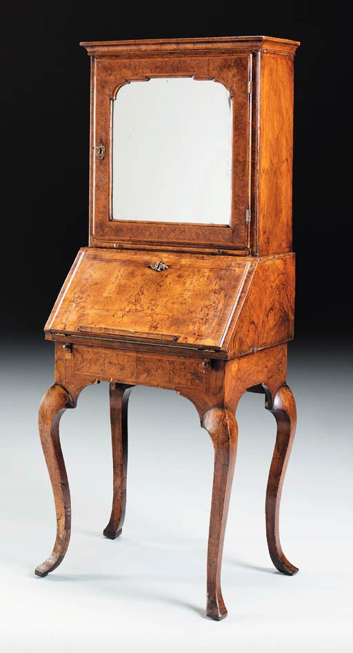 A QUEEN ANNE BURR WALNUT AND WALNUT BUREAU-ON-STAND