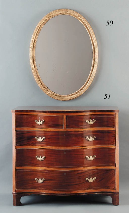 A GEORGE III SATINWOOD AND MAHOGANY CHEST-OF-DRAWERS