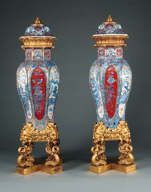 A pair of ormolu-mounted over-decorated Japanese blue-and-white porcelain vases and covers