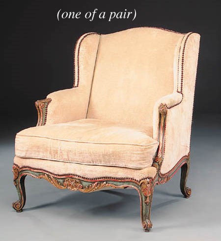 A pair of French parcel-gilt green-painted bergères à oreilles