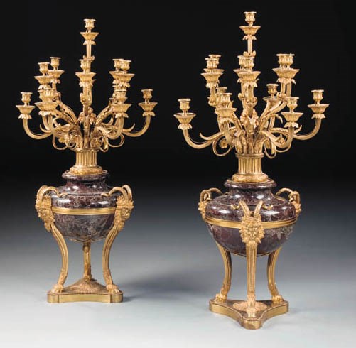 A pair of French gilt-bronze and red Levanto marble thirteen-light candelabra