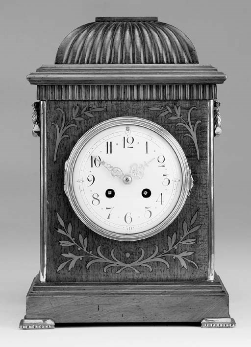 A French mahogany and cut-brass inlaid striking mantel clock, early 20th century